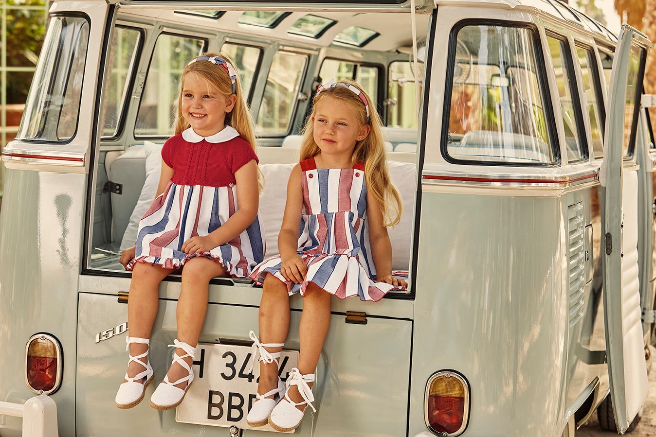 STRIPED DRESS WITH STRAPS AND TWO RUFFLED LAYERS 